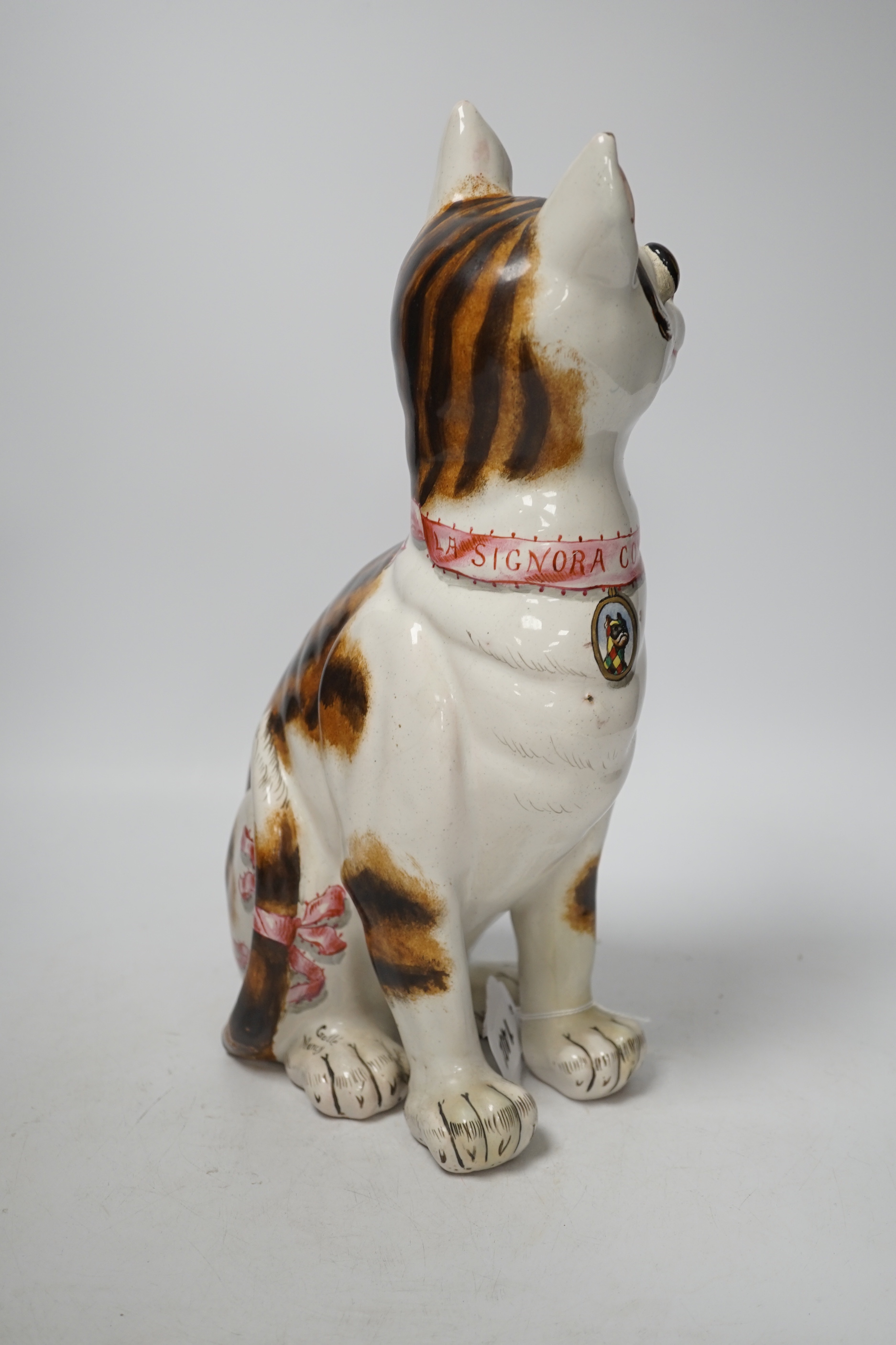 A Gallé faience cat ‘La Signara Colombina’ with glass eyes, signed Gallé Nancy to hind right foot, 32cm high